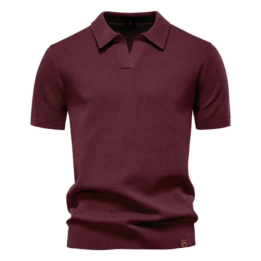 Detail shot of split neckline and collar on men's textured knit polo shirt