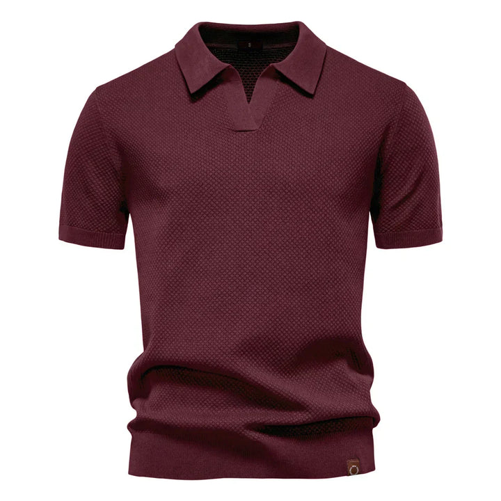 Detail shot of split neckline and collar on men's textured knit polo shirt