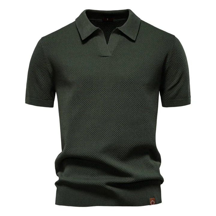 Men's knit polo shirt textured solid design showing tailored fit and ribbed hem detail