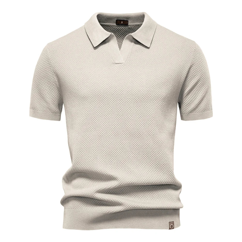 Back view of men's short-sleeve knit polo with all-over textured pattern