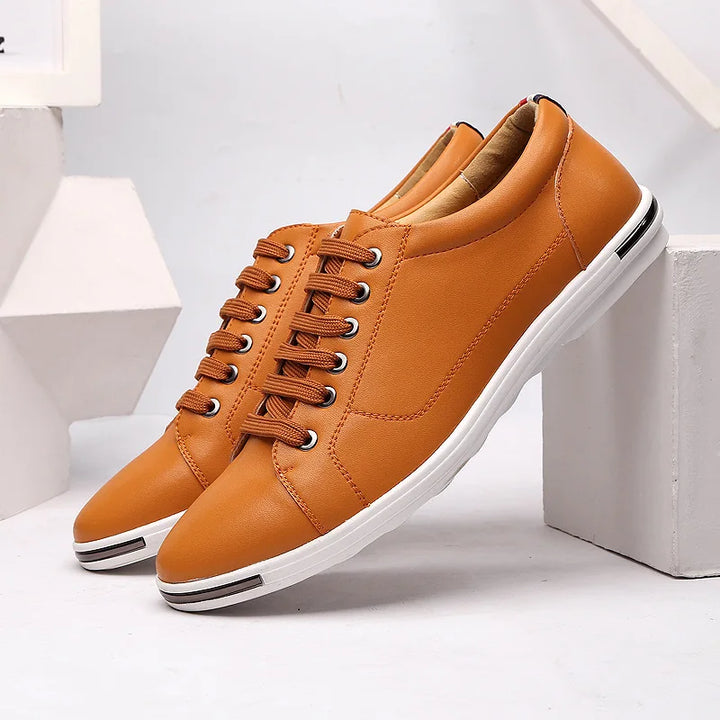 Top view of men's lace-up sneakers highlighting rounded toe and structured upper design