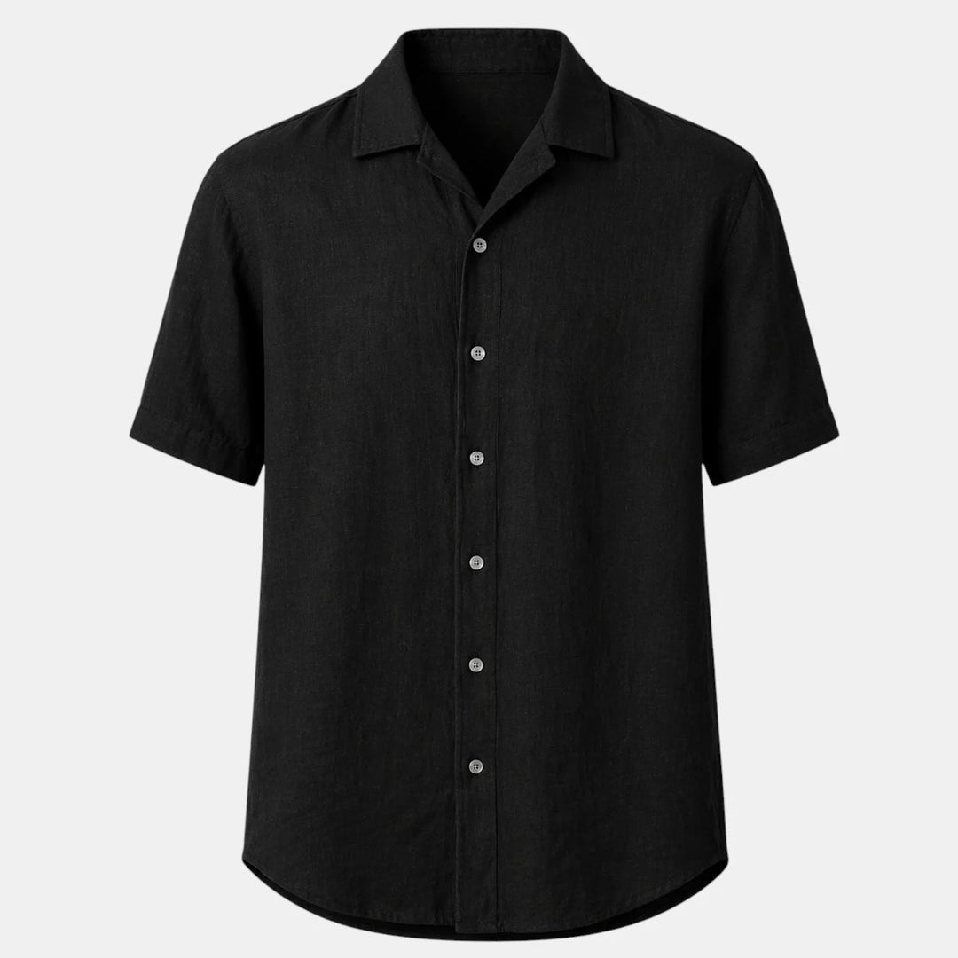 Men's short sleeve shirt in black with classic collar and button-front closure on a neutral background