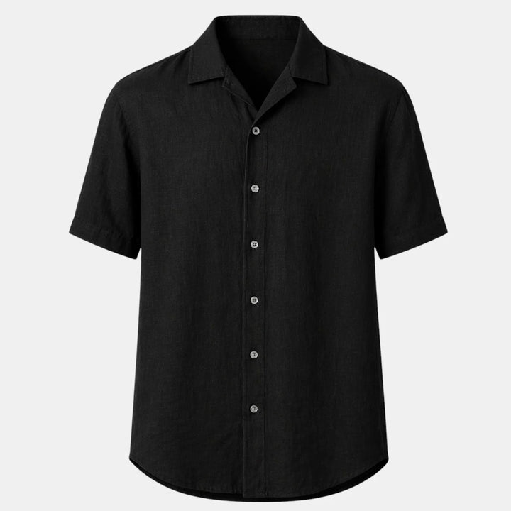Men's short sleeve shirt in black with classic collar and button-front closure on a neutral background