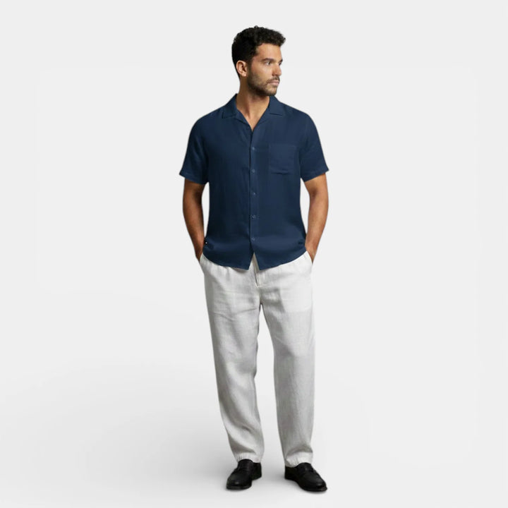 Men's button-up short sleeve shirt in black displayed showing full front and sleeve length