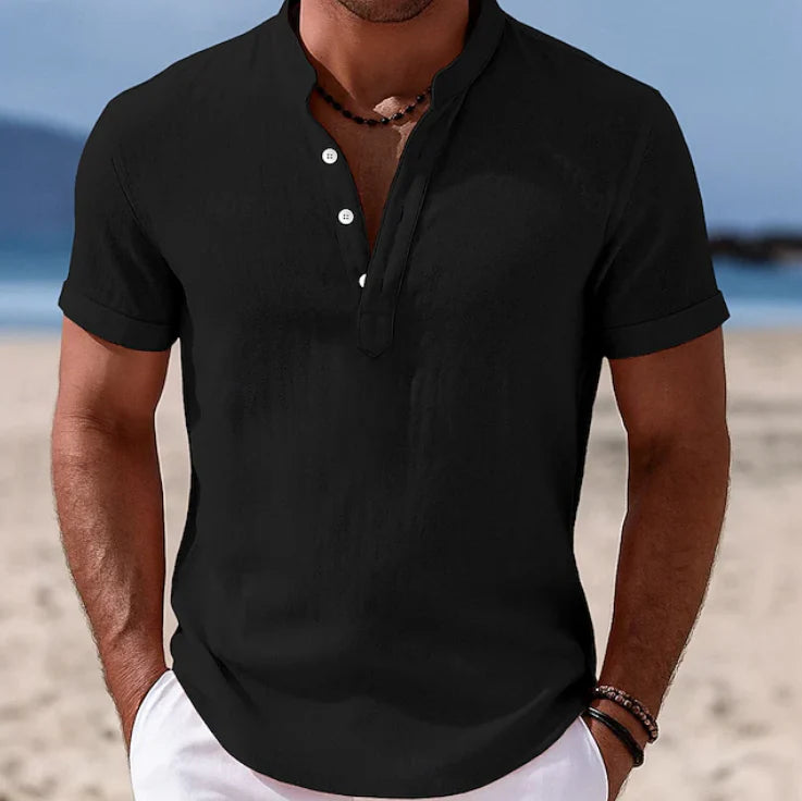 Men's black Summer Button-Up Short Sleeve Shirt with collar and button placket worn on beach