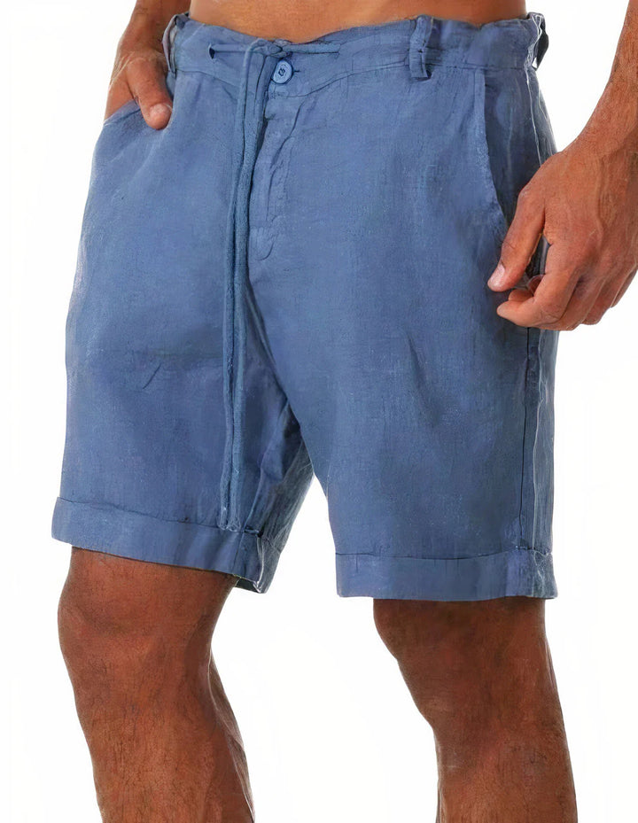 Side angle of men's relaxed fit chino shorts with functional front pockets and mid-length cut