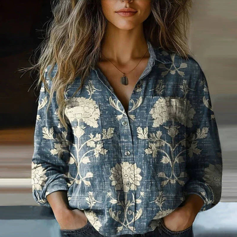 Side angle of women's long sleeve bohemian blouse with printed floral pattern and classic collar