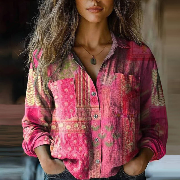 Detail shot of women's bohemian blouse featuring ornamental print and cuffed long sleeves