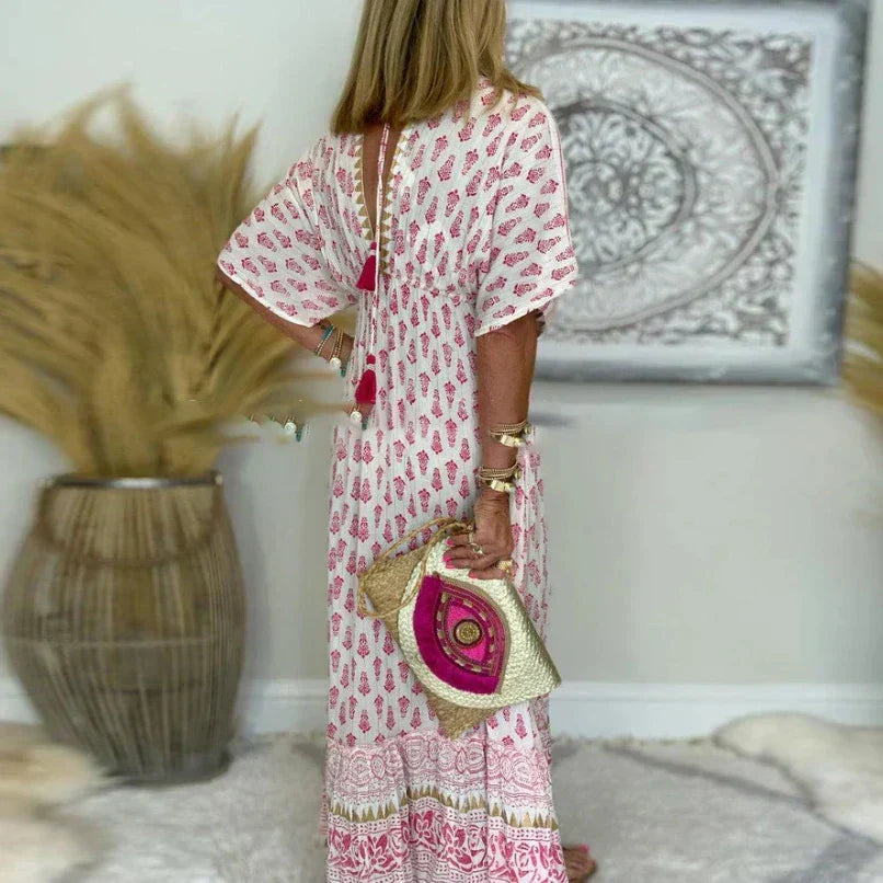 Close-up of paisley-inspired print pattern and border detail on boho maxi dress