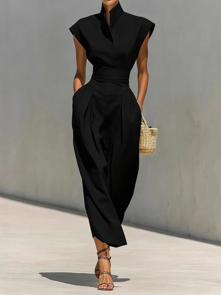 Side view of structured midi dress showing sleeveless cut and hidden pocket detail with smooth drape
