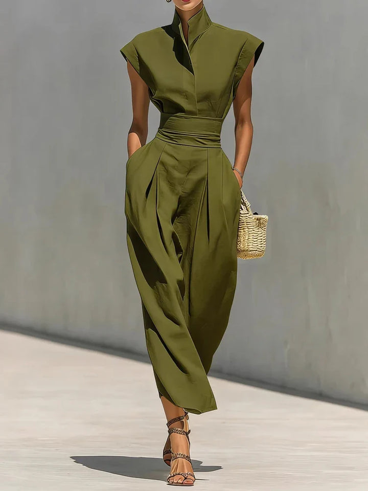 Full-length view of structured midi dress displaying cinched waist and flowing midi-length skirt silhouette