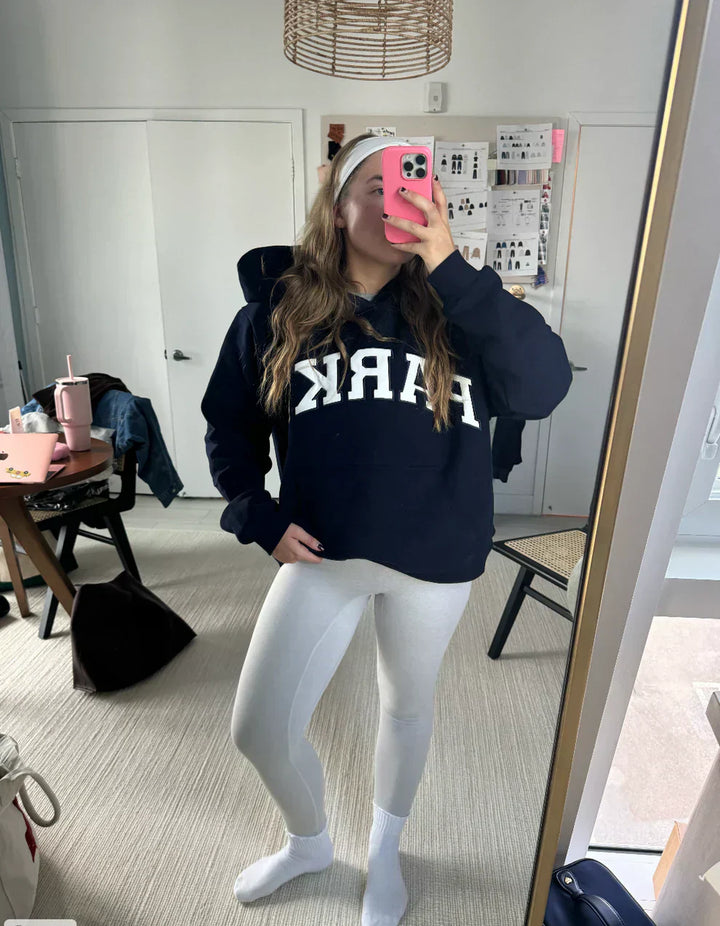 Pastel yellow varsity sweatshirt with white chenille letters and crewneck