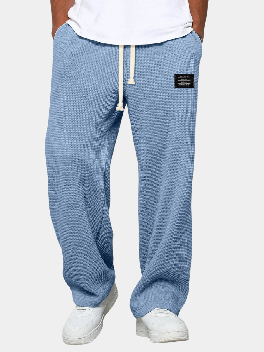 Men's waffle knit joggers in sky blue with white drawstring and relaxed straight leg fit