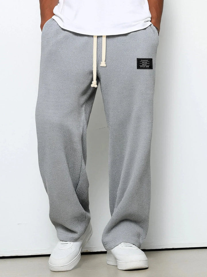 Men's casual joggers in waffle knit fabric with comfortable stretch and modern straight cut