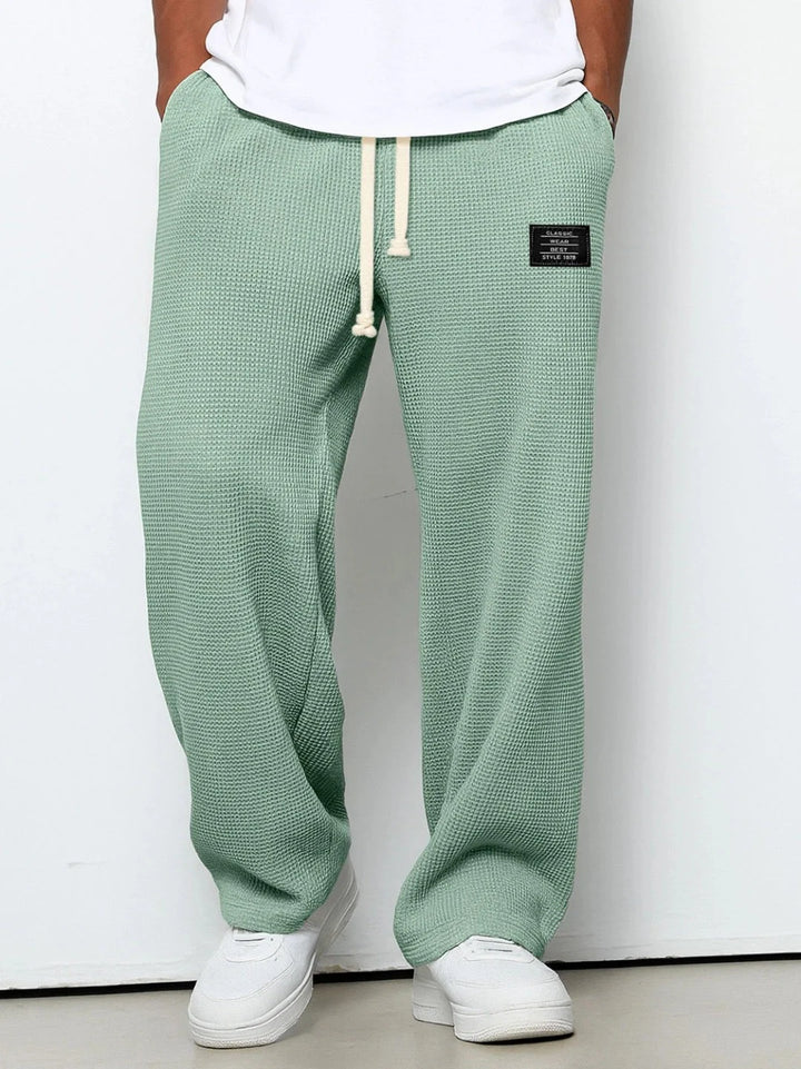 Sky blue waffle joggers paired with white polo shirt for casual everyday style