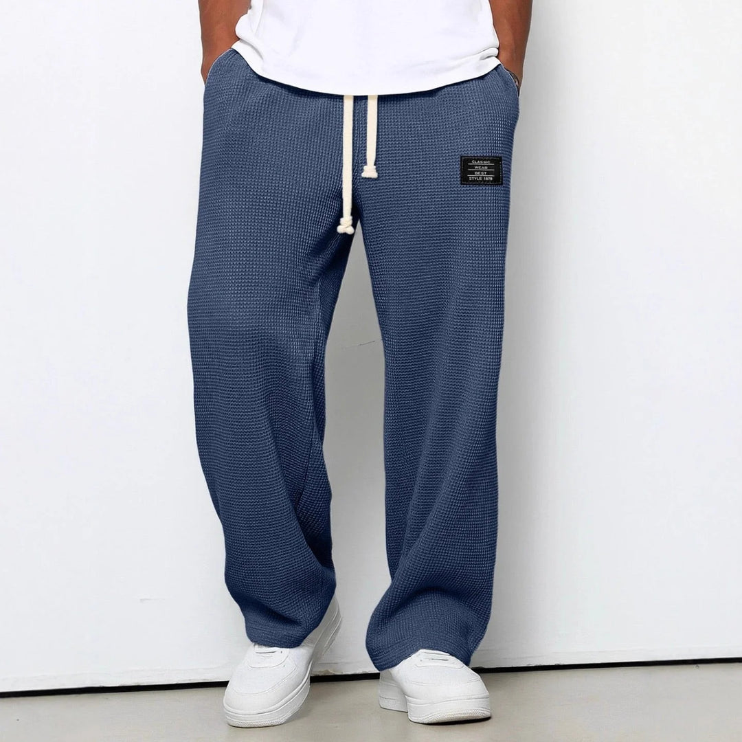 Close-up of waffle knit texture and contrasting white drawstring closure on joggers