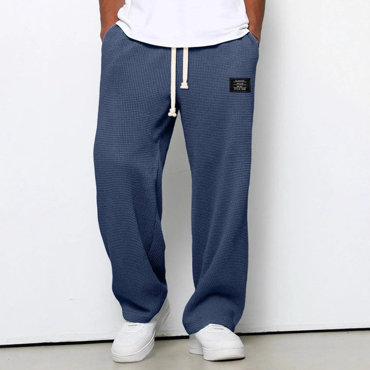 Close-up of waffle knit texture and contrasting white drawstring closure on joggers