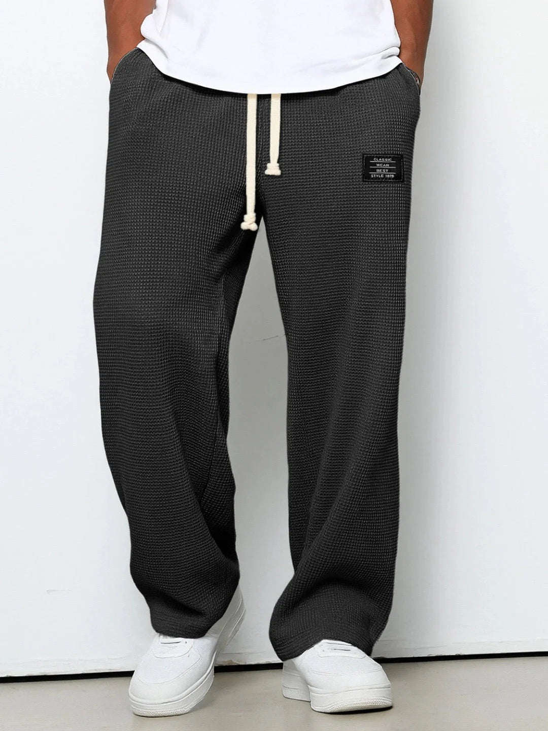 Men's straight leg joggers in textured waffle fabric with patch accent detail
