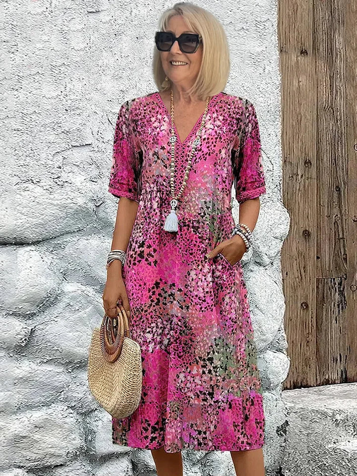 Side view showing the relaxed A-line silhouette and midi length of this cotton summer dress