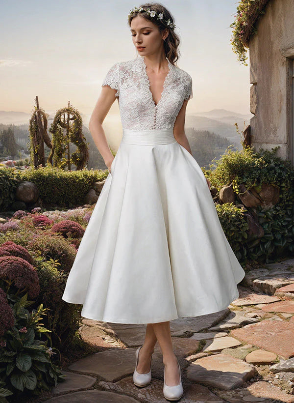 Lace midi wedding dress with V-neckline and A-line skirt for garden ceremonies and intimate receptions