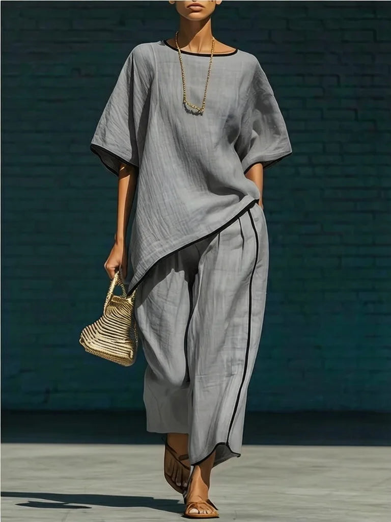 Detail shot of elastic waist pants and contrast piping on linen pant set