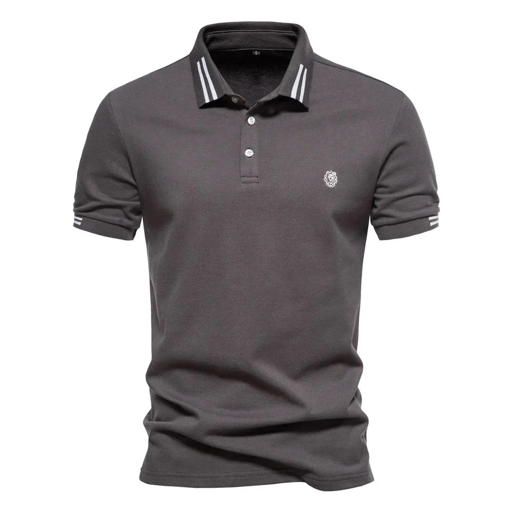 Close-up of pointed collar with white stripe trim on men's short-sleeve polo shirt