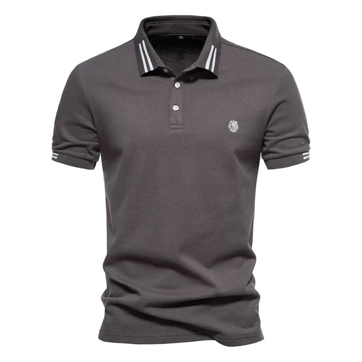 Close-up of pointed collar with white stripe trim on men's short-sleeve polo shirt