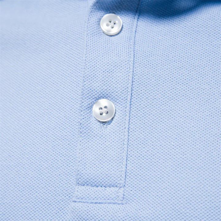 Close-up of three-button placket on men's stripe trim polo shirt