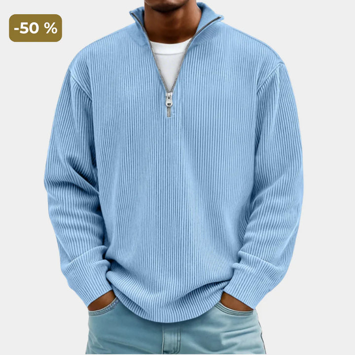Men's zipper high neck sweater in light blue with textured ribbed knit and half-zip collar worn casually