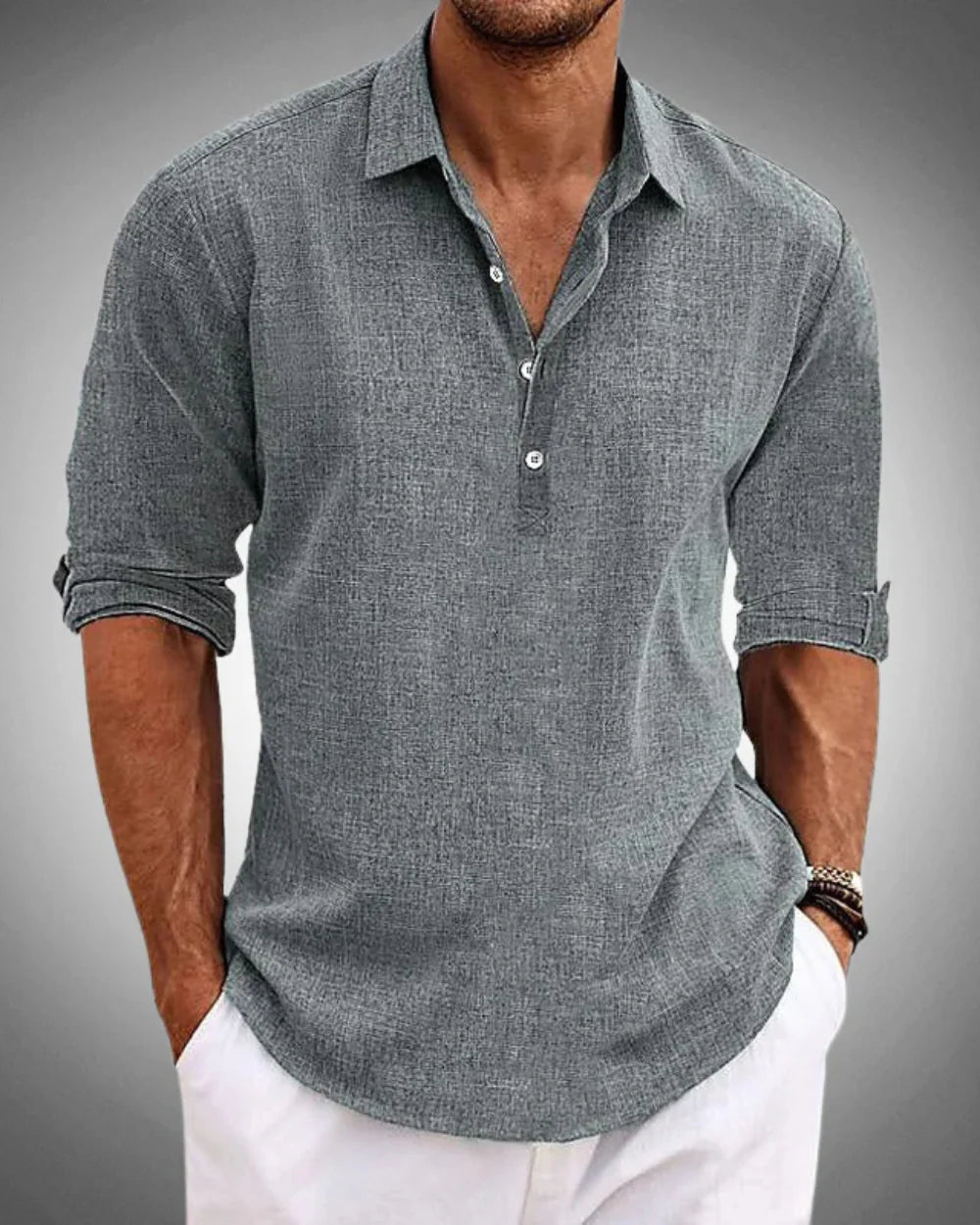 Full view of men's casual long sleeve popover shirt paired with white pants