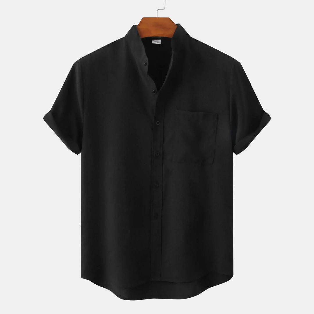 Men's short sleeve casual shirt in black with button-front closure and chest pocket on hanger