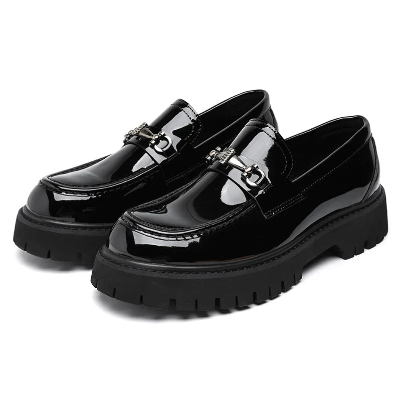 Women's leather dress loafers in black on neutral background showing polished construction