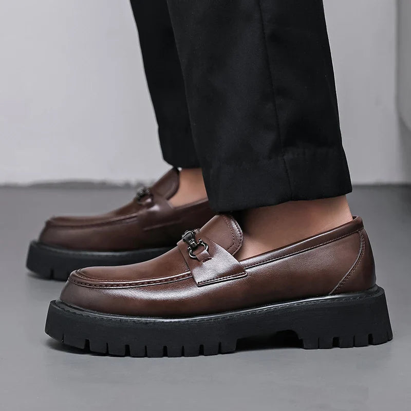 Women's leather dress loafers in black with metal buckle and chunky sole