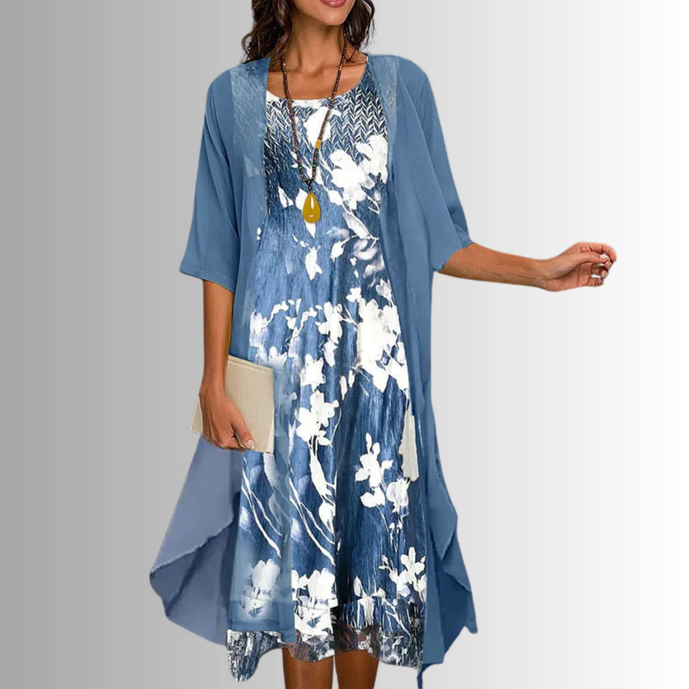 Side view of layered midi dress showing open front overlay and flowing silhouette