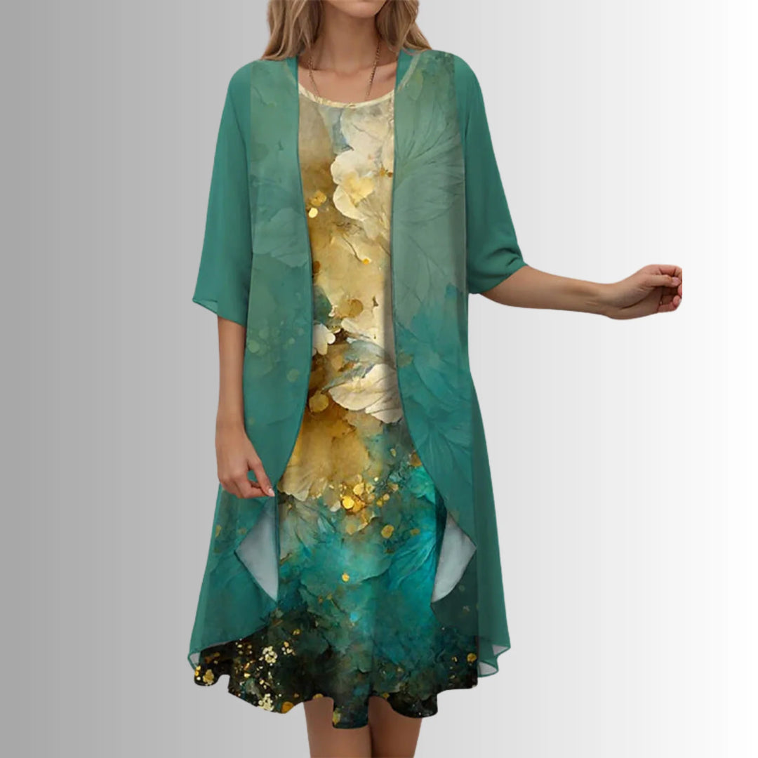 Back view of layered midi dress showing draped overlay and mid-calf length