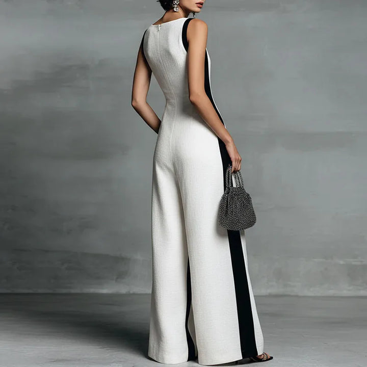 Close-up view of wide leg jumpsuit showing deep V neckline and sleeveless design with side panels