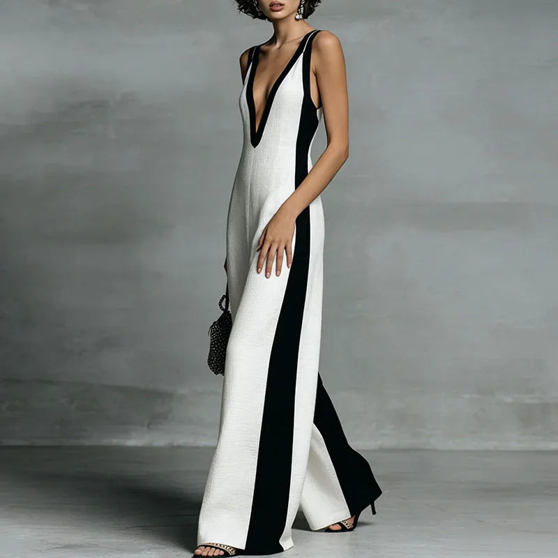 Side angle of wide leg jumpsuit displaying flowing wide-leg silhouette and contrast panel detail
