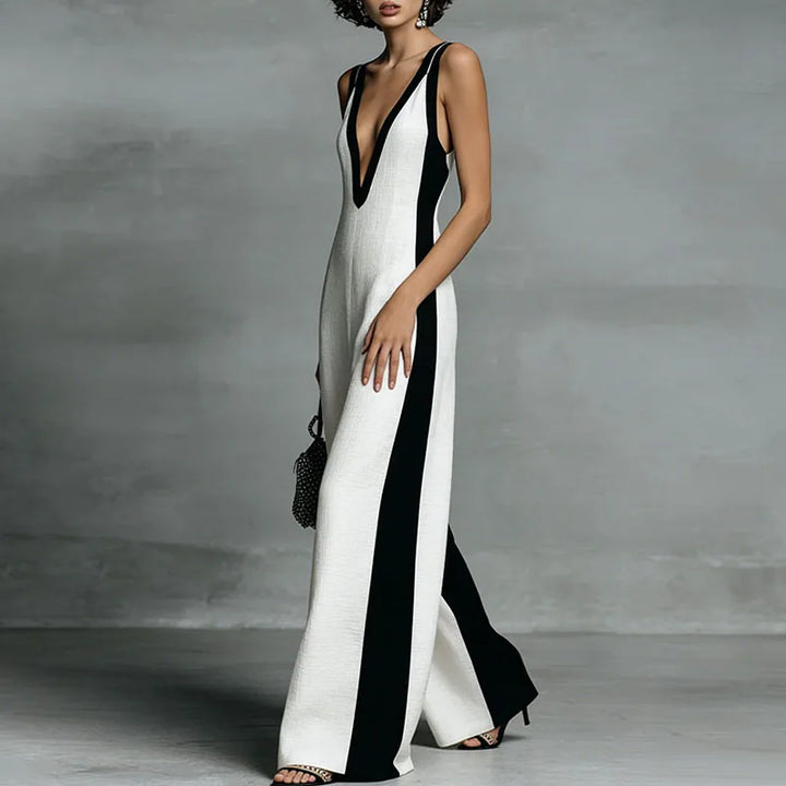 Side angle of wide leg jumpsuit displaying flowing wide-leg silhouette and contrast panel detail