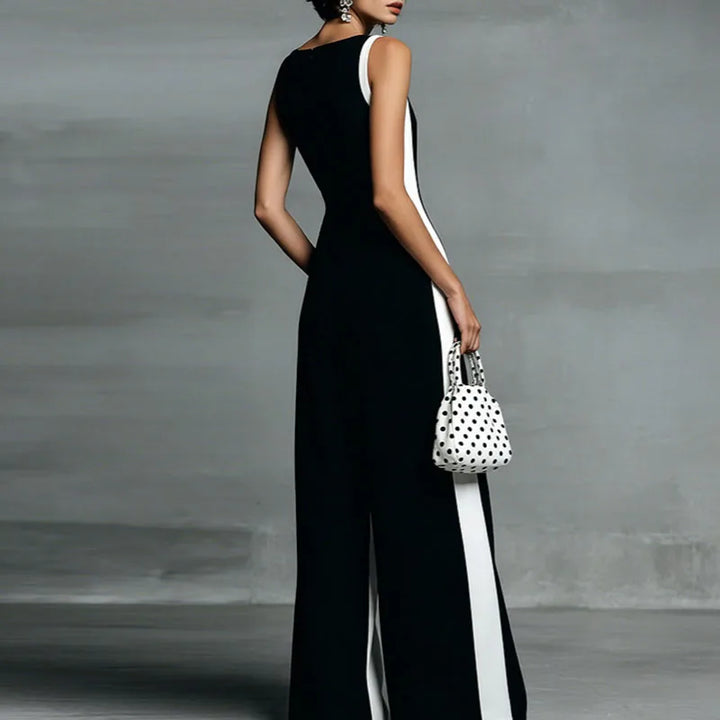 Full length view of wide leg jumpsuit with deep V neckline and modern side panel construction