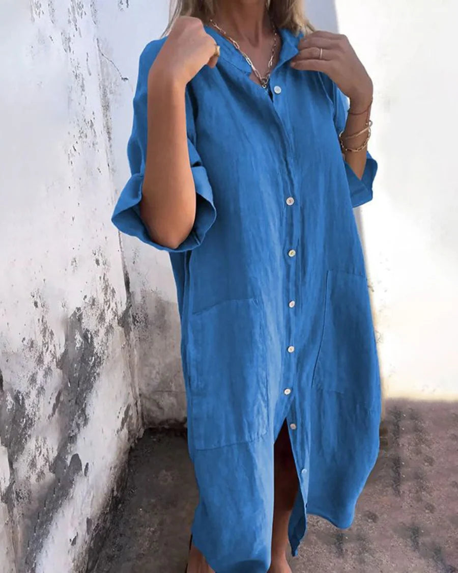 Side view of relaxed-fit shirt dress with A-line hem and functional side pockets
