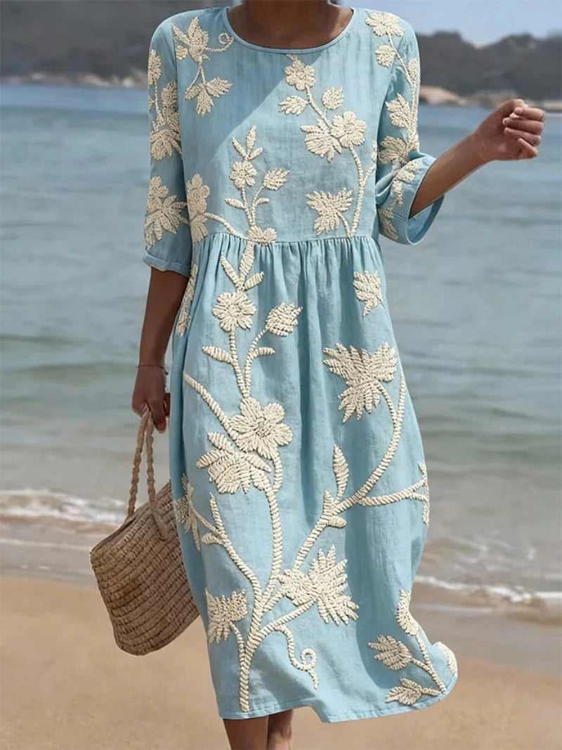 Elegant Embroidered Midi Dress with intricate floral embroidery and three-quarter sleeves in soft blue