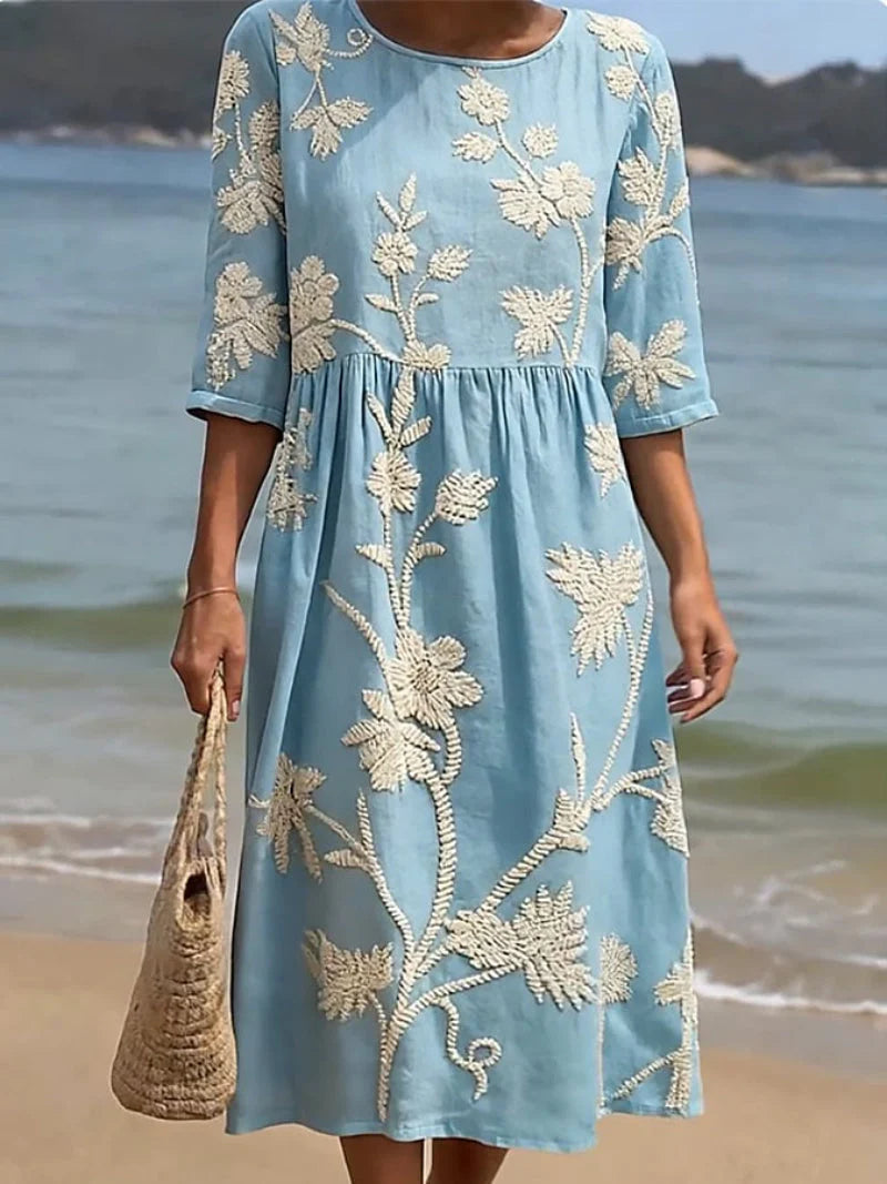 Close-up view of the raised floral embroidery detail on the Elegant Embroidered Midi Dress bodice