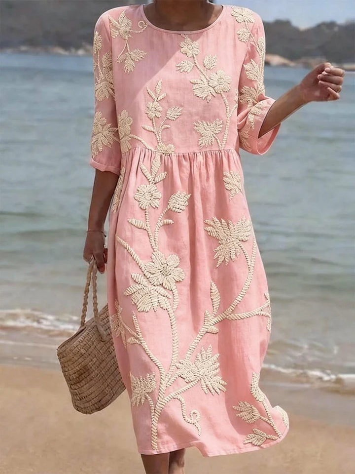 Side view of the Elegant Embroidered Midi Dress showing the gathered waist and flowing midi skirt