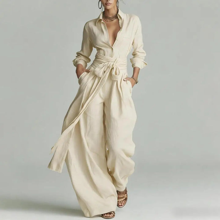 Woman wearing a cream Linen Co-Ord Set with open-collar button shirt and high-rise wide-leg pants with self-tie waist detail