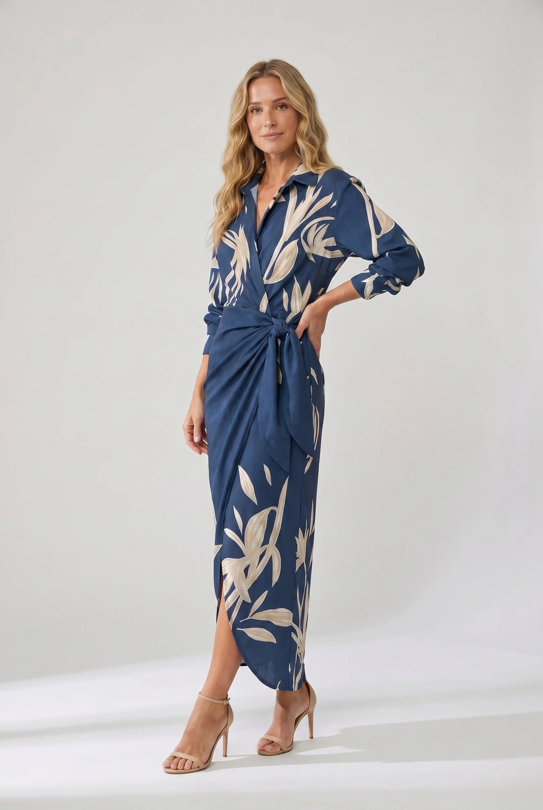 Close-up of collared V-neckline and three-quarter sleeves on leaf print wrap dress