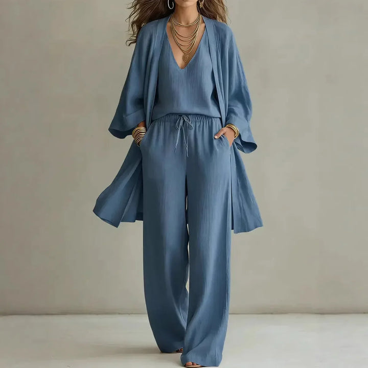 Full length view of three piece linen set with open cardigan, drawstring pants, and layered top