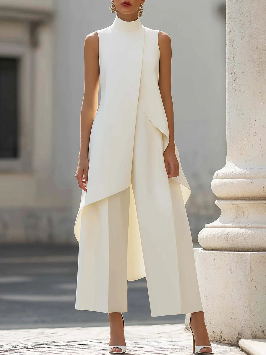 Women's sleeveless turtleneck two-piece set with wide-leg pants and asymmetric draped overlay in cream white