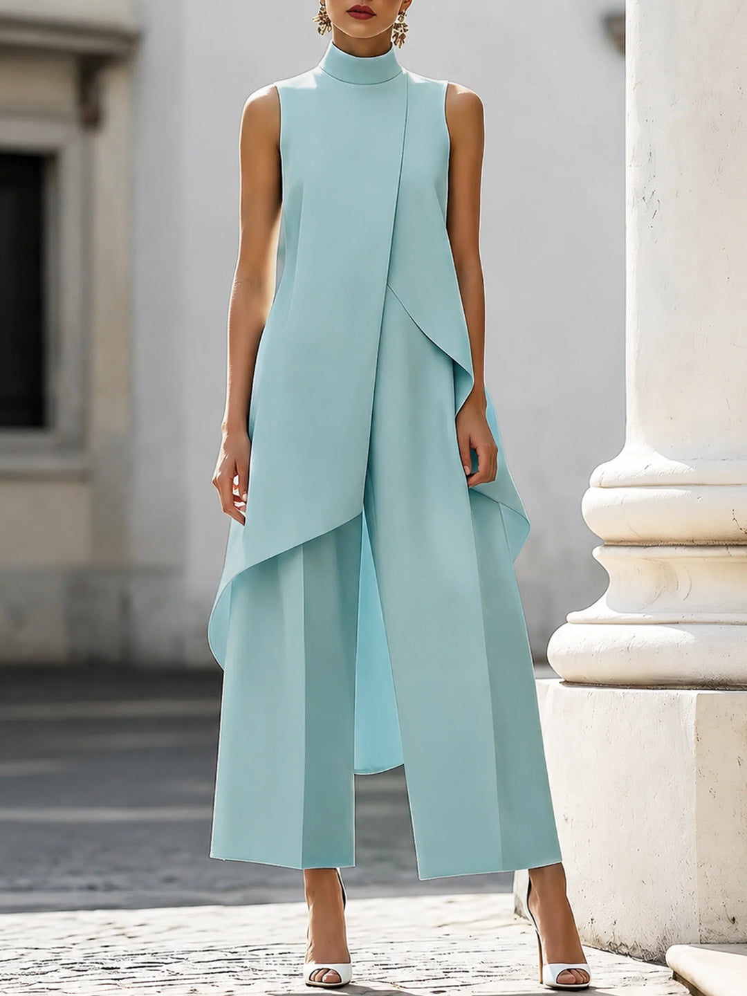 Navy blue women's two-piece set featuring sleeveless turtleneck and architectural drape