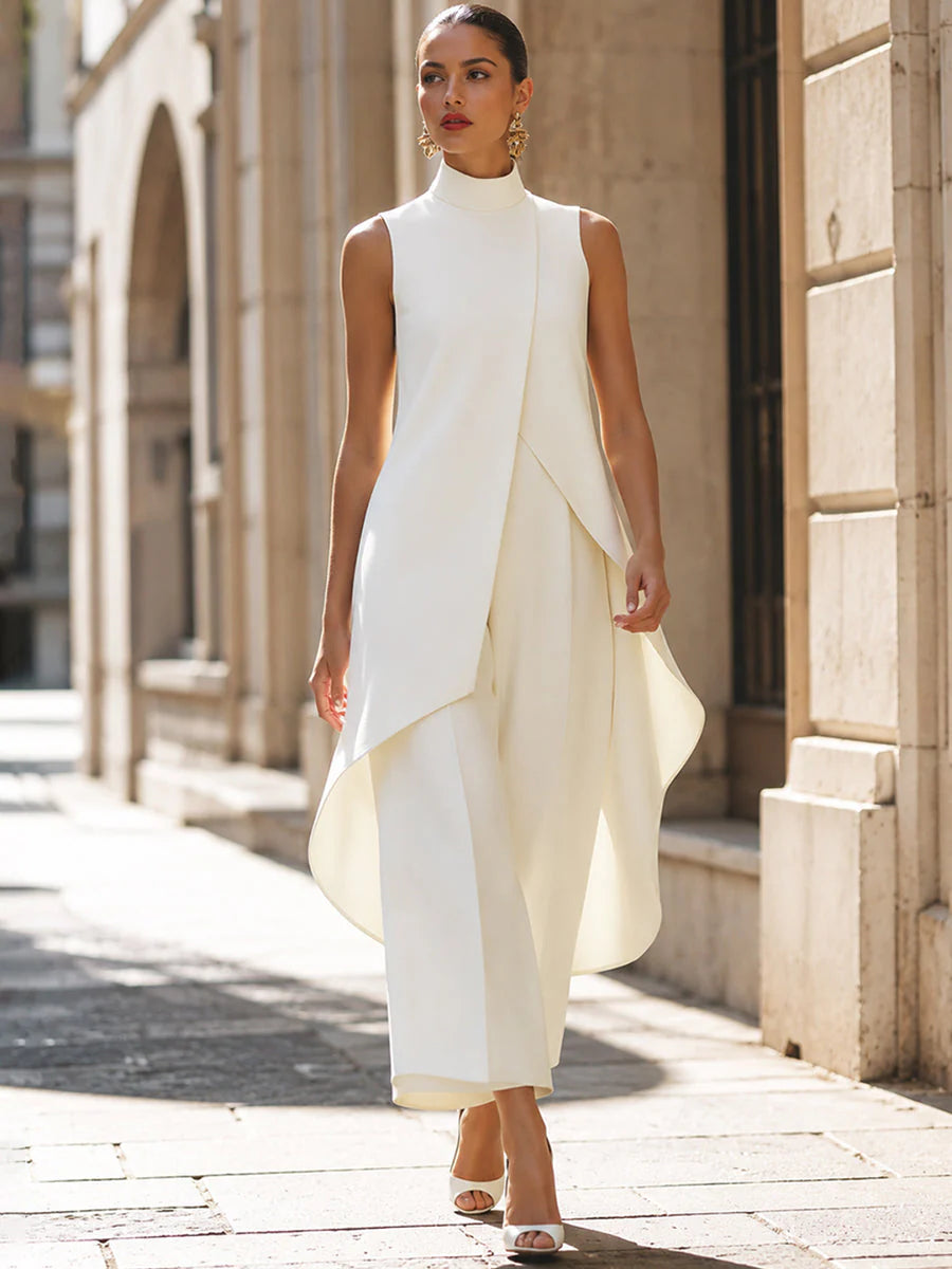 Side angle of sleeveless turtleneck two-piece set highlighting structured silhouette and fluid drape