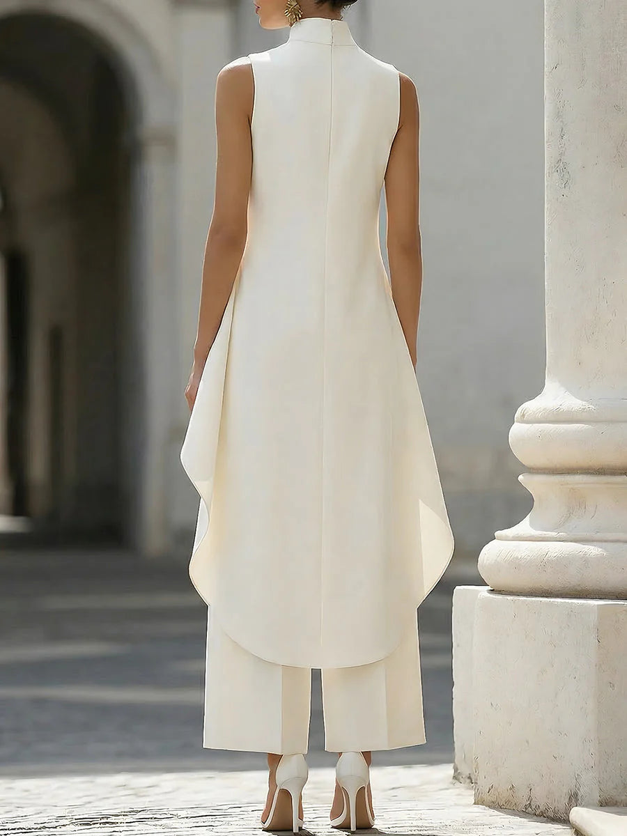 Close-up of high neckline and asymmetric draped detail on women's two-piece set